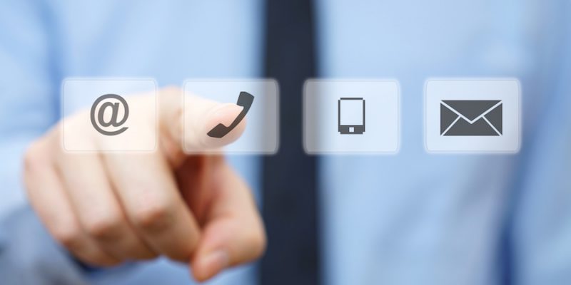businessman pressing phone button, company identification icons